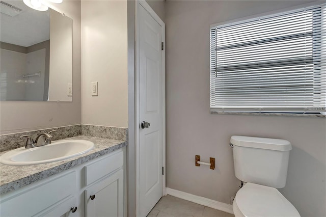 full bath featuring vanity, baseboards, visible vents, tile patterned floors, and toilet