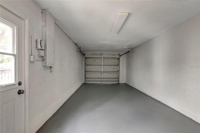 garage featuring concrete block wall