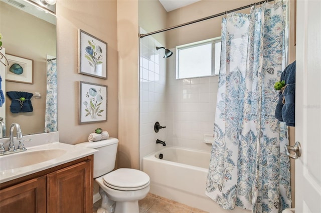 full bath with tile patterned floors, vanity, toilet, and shower / tub combo with curtain