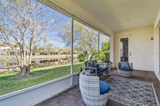 sunroom with a water view