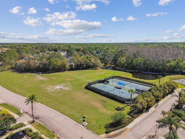 drone / aerial view featuring a view of trees