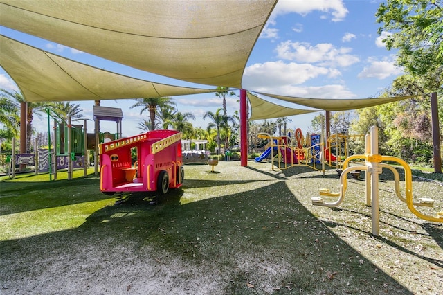 communal playground featuring a lawn