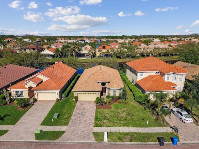 birds eye view of property with a residential view