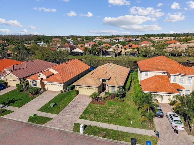 birds eye view of property with a residential view