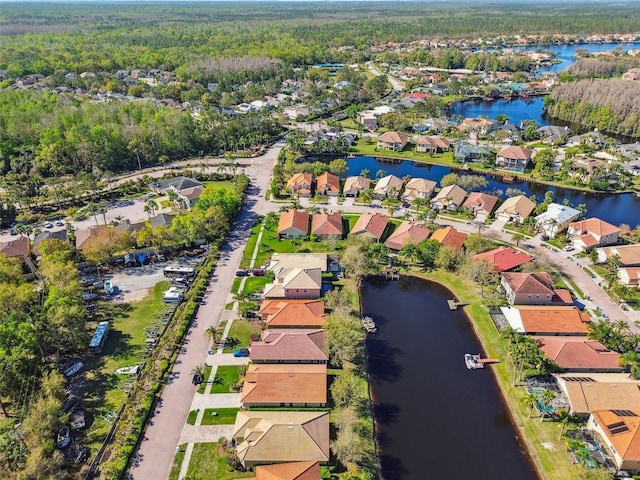 birds eye view of property featuring a residential view and a water view