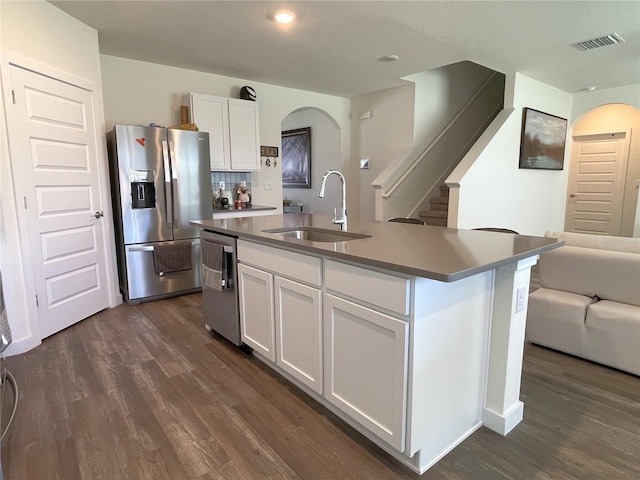 31888 Treasure Dock Isle, Wesley Chapel, FL 33545 - kitchen featuring appliances with stainless steel finishes, dark wood-style flooring, a sink, white cabinetry, and visible vents