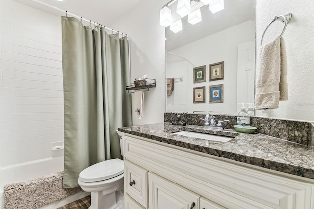 bathroom featuring shower / bath combination with curtain, toilet, and vanity