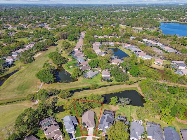 drone / aerial view featuring a residential view and a water view