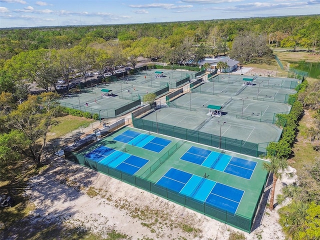 birds eye view of property featuring a view of trees