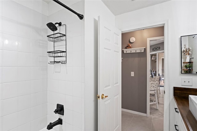 full bath featuring tile patterned flooring and  shower combination