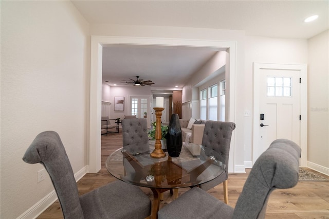 dining space with recessed lighting, baseboards, and light wood-style floors