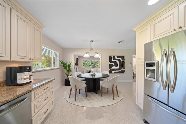 dining space featuring visible vents and baseboards