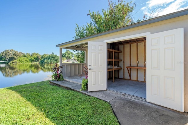 view of outbuilding with an outdoor structure and a water view