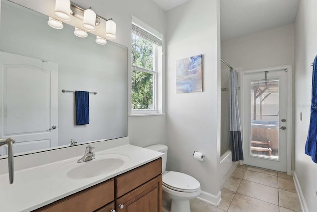 full bathroom featuring tile patterned flooring, baseboards, toilet, shower / tub combo, and vanity