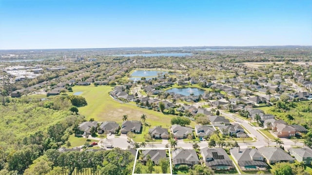 bird's eye view with a residential view and a water view