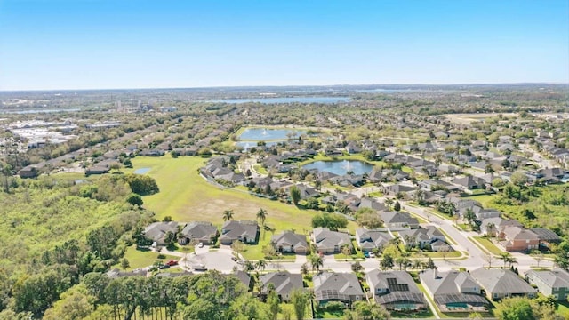 bird's eye view featuring a residential view and a water view