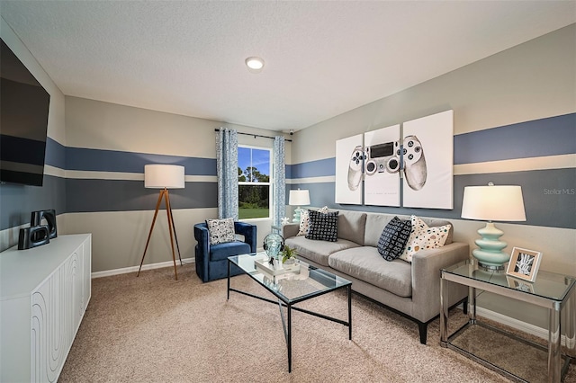 living area featuring baseboards, light carpet, and a textured ceiling