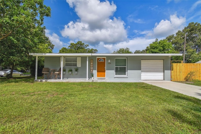 ranch-style home with a garage, concrete driveway, a front yard, and fence