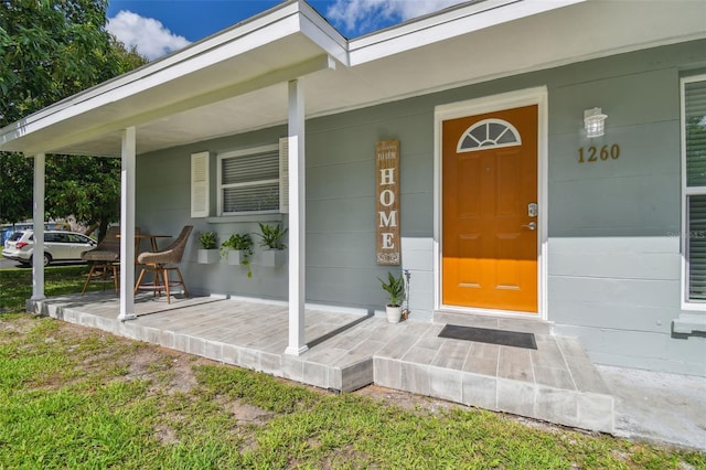 entrance to property with covered porch