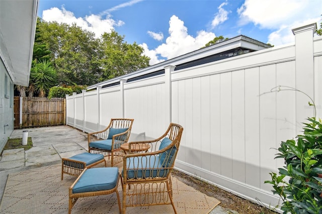 view of patio featuring fence