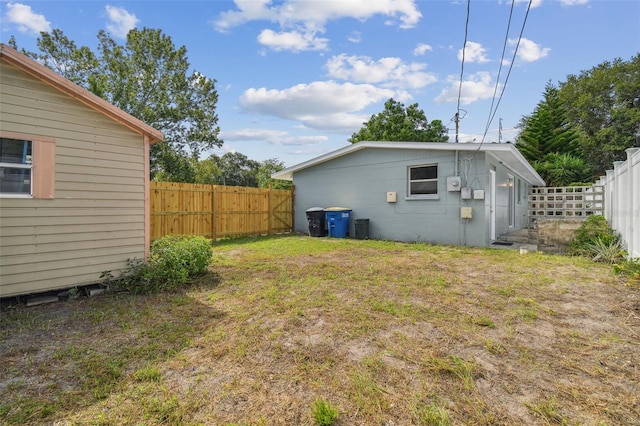 view of yard with a fenced backyard