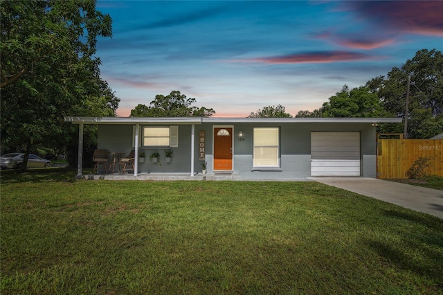 1260 S Hillcrest Ave, Clearwater, FL 33756 - view of front of home featuring concrete driveway, an attached garage, and covered porch