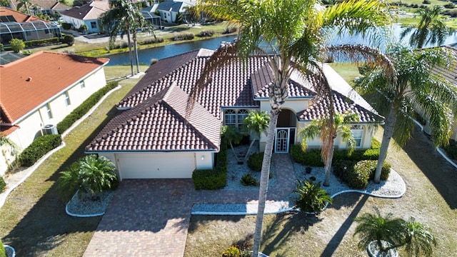 birds eye view of property with a residential view and a water view