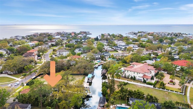 birds eye view of property with a residential view and a water view