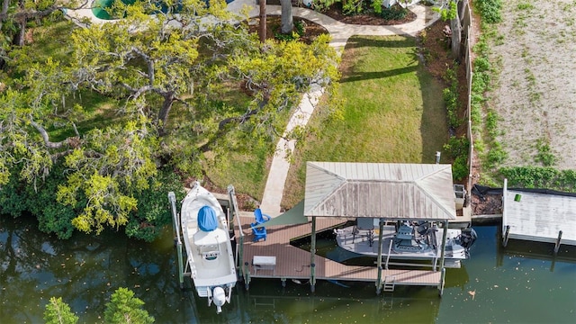 dock area featuring boat lift and a water view