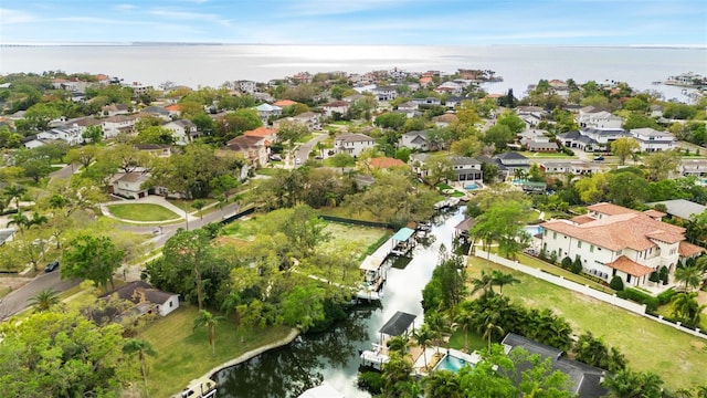 bird's eye view featuring a residential view and a water view