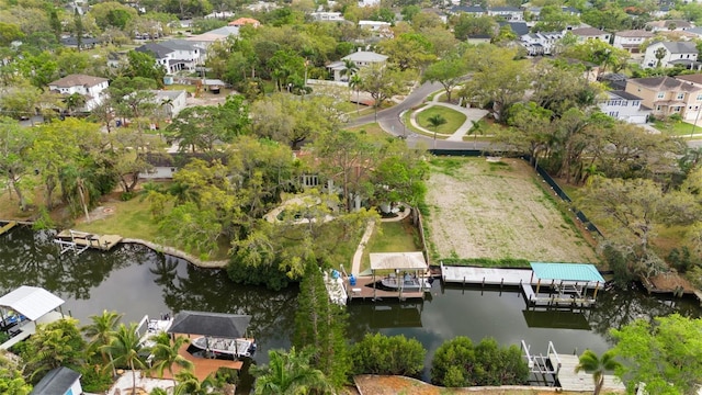 drone / aerial view featuring a residential view and a water view