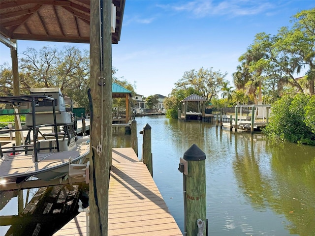 view of dock with a water view and boat lift
