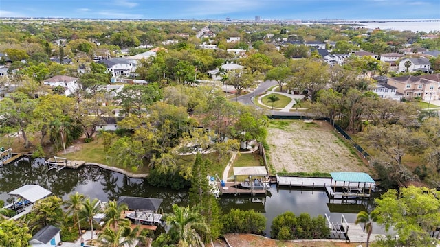 drone / aerial view featuring a residential view and a water view