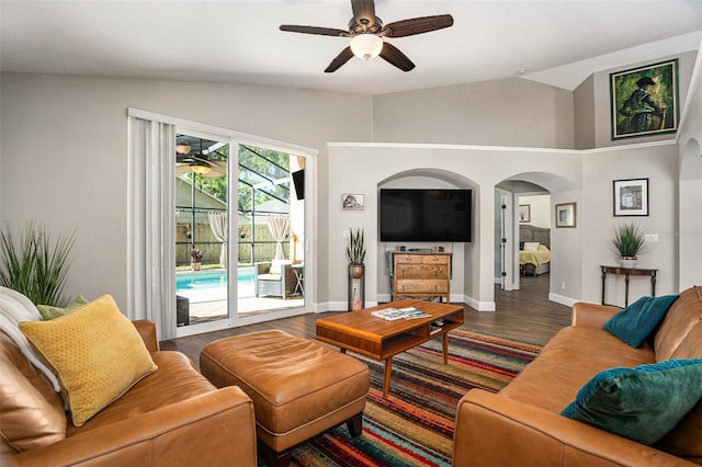7116 Colonial Lake Dr, Riverview, FL 33578 - living area featuring vaulted ceiling, a ceiling fan, wood finished floors, arched walkways, and baseboards