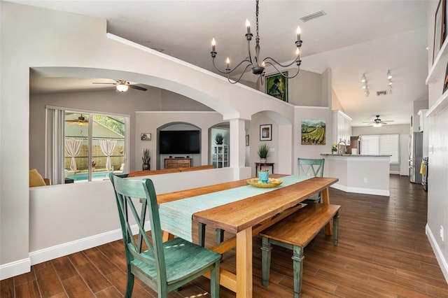 7116 Colonial Lake Dr, Riverview, FL 33578 - dining room featuring lofted ceiling, arched walkways, ceiling fan, dark wood-style floors, and baseboards