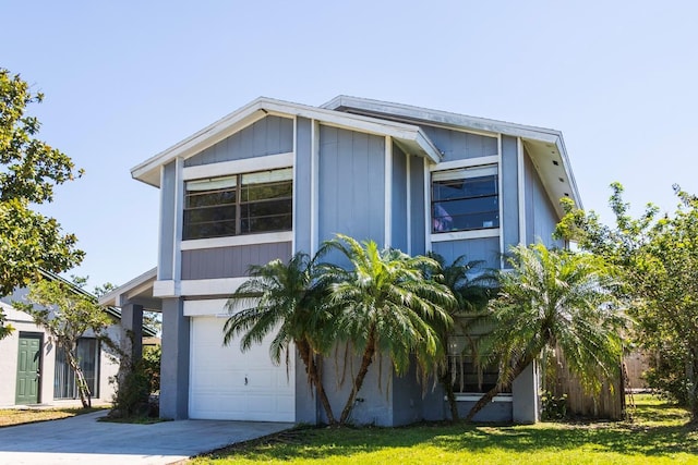 view of side of property featuring an attached garage and driveway