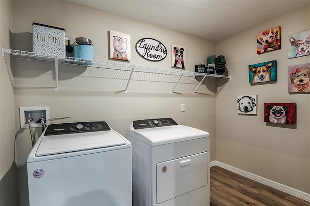 washroom with dark wood finished floors, laundry area, baseboards, and washer and clothes dryer