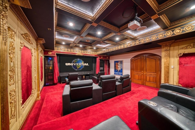 cinema with arched walkways, carpet flooring, coffered ceiling, and ornamental molding