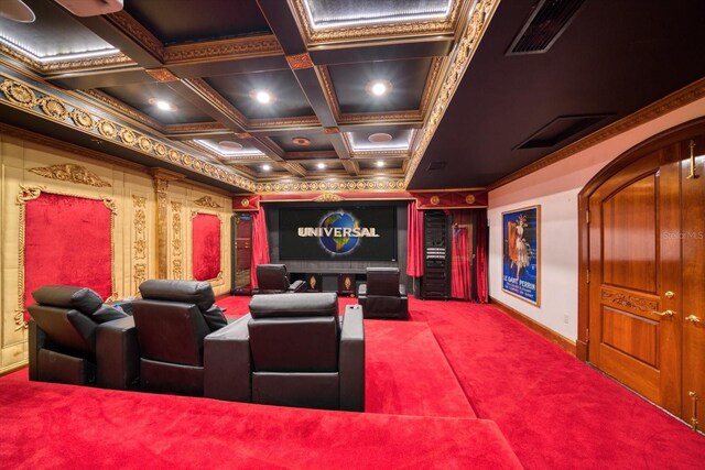 cinema featuring visible vents, beamed ceiling, ornamental molding, coffered ceiling, and carpet flooring