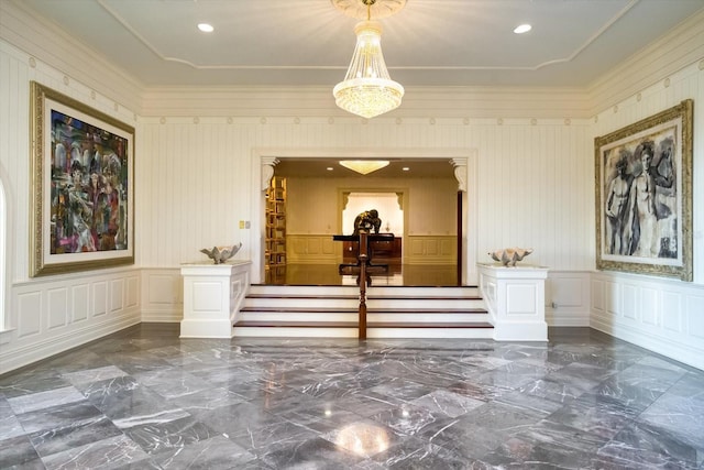 corridor with a decorative wall, recessed lighting, and marble finish floor