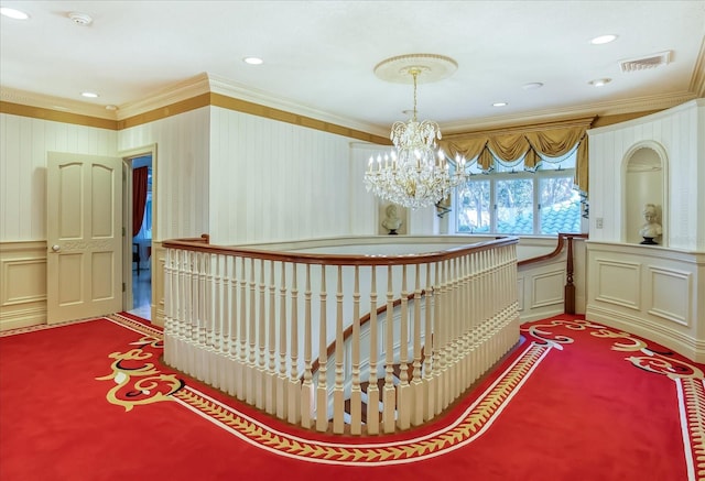 interior space featuring visible vents, crown molding, carpet floors, recessed lighting, and a notable chandelier