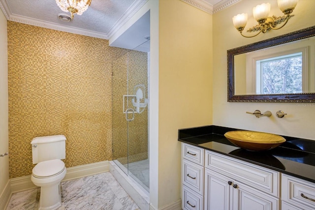 bathroom with vanity, a shower stall, crown molding, toilet, and marble finish floor