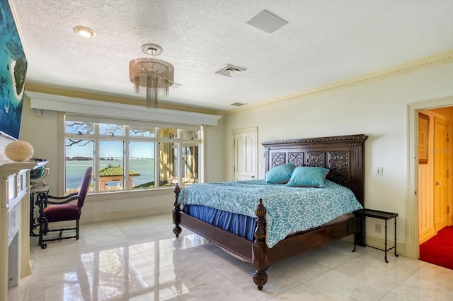 bedroom with visible vents, baseboards, a textured ceiling, and crown molding