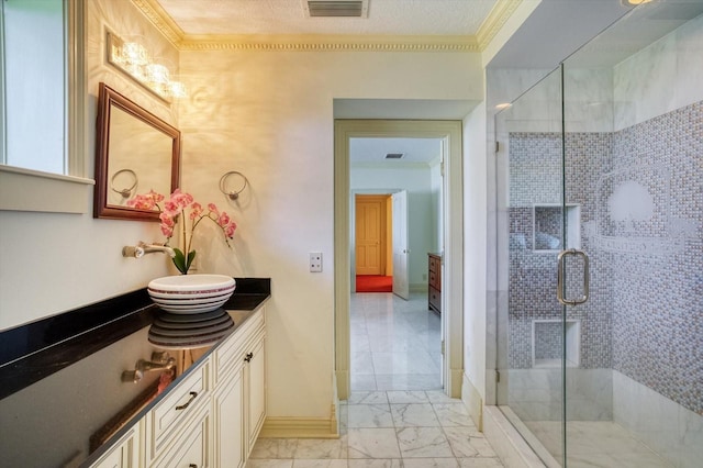 full bathroom with visible vents, a shower stall, baseboards, marble finish floor, and vanity