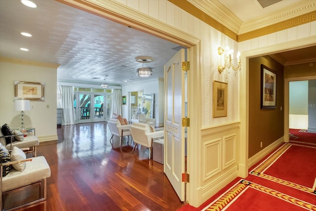 hallway featuring baseboards, recessed lighting, dark wood-type flooring, french doors, and crown molding