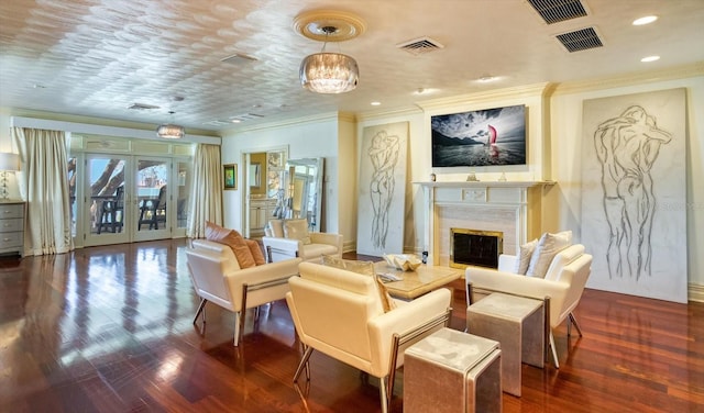 interior space featuring crown molding, wood finished floors, visible vents, and a premium fireplace