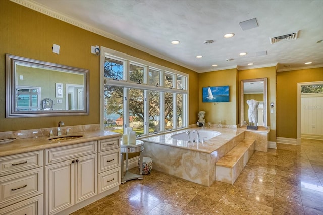 full bath featuring visible vents, crown molding, baseboards, a garden tub, and vanity