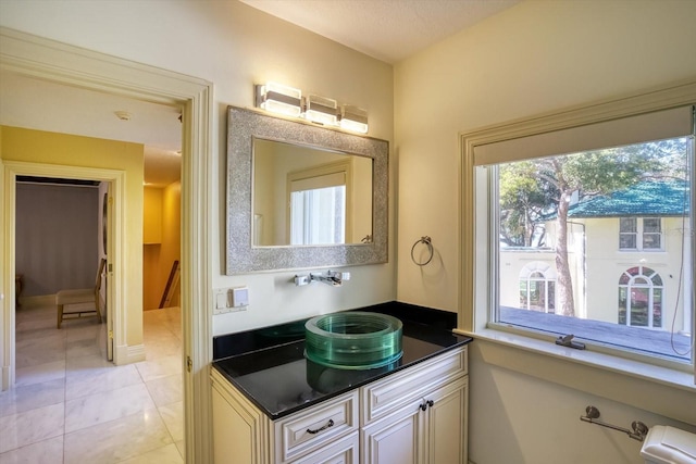 bathroom with vanity and tile patterned flooring