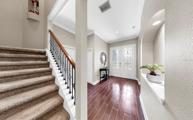 5324 Moon Shell Dr, Apollo Beach, FL 33572 - entryway featuring crown molding, dark wood finished floors, stairs, baseboards, and a textured wall