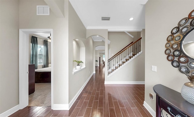 5324 Moon Shell Dr, Apollo Beach, FL 33572 - foyer entrance with baseboards, stairway, dark wood-style floors, recessed lighting, and arched walkways